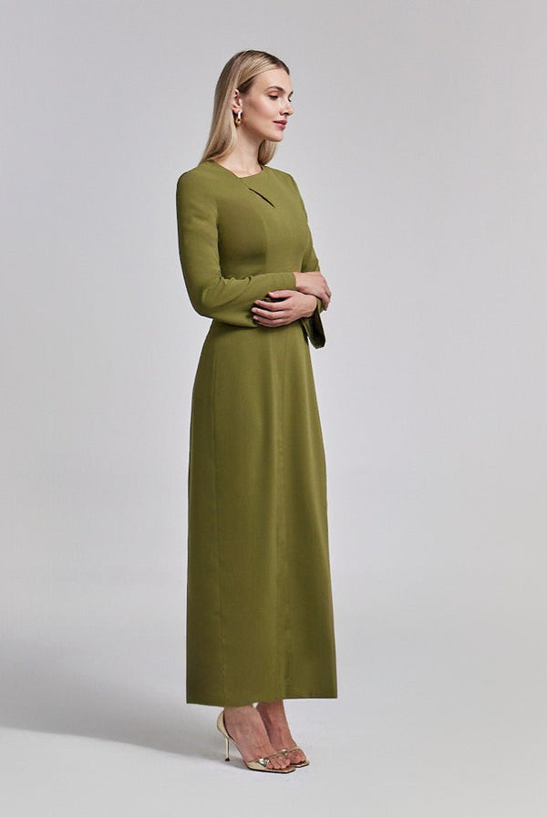 Woman in an olive crepe long-sleeve dress